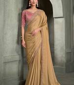 beige gold faux georgette saree with onion pink embroidered blouse