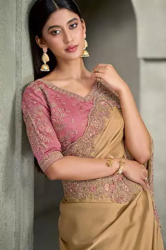 beige gold faux georgette saree with onion pink embroidered blouse