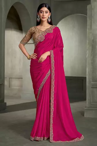 rani pink faux crepe saree with embroidered border and blouse