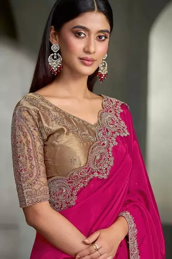 rani pink faux crepe saree with embroidered border and blouse