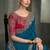 teal blue faux crepe saree with crimson red embroidered blouse