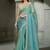 sea green shimmer faux tissue saree with cream embroidered blouse