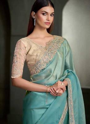 sea green shimmer faux tissue saree with cream embroidered blouse 2