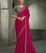 rani pink faux chiffon saree with green embroidered blouse