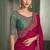 rani pink faux chiffon saree with green embroidered blouse
