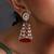 Gold plated ruby red polki jhumka earrings