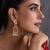 Gold plated red polki dangler earrings