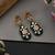 Gold plated green polki dangler earrings