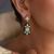 Gold plated green polki dangler earrings