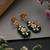 Gold plated green polki dangler earrings