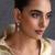 Gold plated green polki dangler earrings