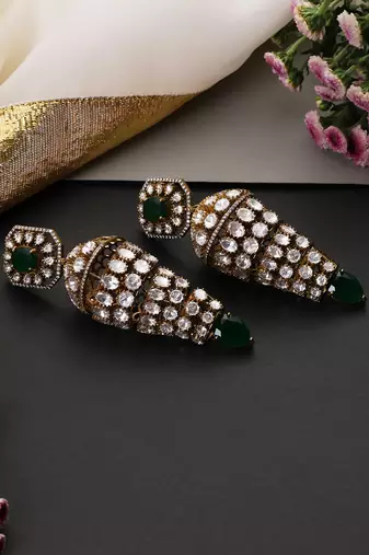 Gold plated emerald green polki jhumka earrings