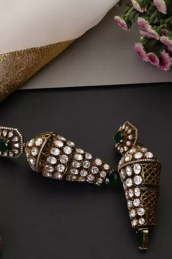 Gold plated emerald green polki jhumka earrings