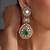 Gold plated emerald green polki dangler earrings