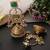 Gold plated emerald green polki kundan jhumka earrings