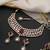 Gold plated ruby red polki necklace set with maang tikka