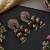 Gold plated red polki jhumka earrings