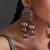 Gold plated red polki jhumka earrings