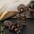 Gold plated red polki jhumka earrings