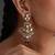 Gold plated ruby red kundan jhumka earrings