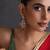 Gold plated ruby red kundan jhumka earrings