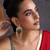 Gold plated emerald green polki dangler earrings