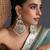 Gold plated white jadau dangler earrings