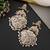 Gold plated white jadau dangler earrings