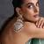 Gold plated white jadau dangler earrings