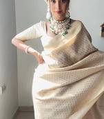 Off white silk blend jacuard work festival saree with unstitched blouse piece