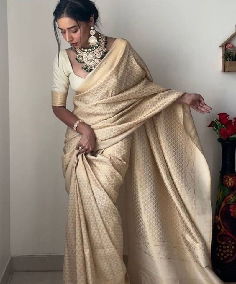 Off white silk blend jacuard work festival saree with unstitched blouse piece