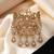 Antique gold twin peacock feather ethnic brooch for men