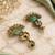 Gold oxidized mint stone chandbali earrings