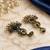 Gold oxidized navy blue stone chandbali earrings