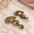 Gold oxidized pink stone chandbali earrings