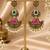 Gold oxidized red green stone chandbali earrings