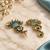Gold oxidized sky blue stone chandbali earrings