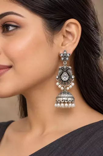 German silver bird motif clear long dome jhumka earrings