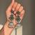 German silver bird motif green long dome jhumka earrings