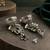 German silver bird motif green long dome jhumka earrings