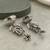 German silver bird motif mint long dome jhumka earrings