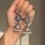 German silver bird motif pink green long dome jhumka earrings
