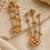 Gold plated peacock motif long kashmiri earrings