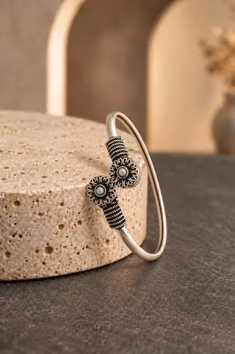 German silver oxidized floral motif white kada bracelet