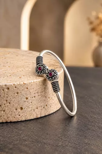 German silver oxidized floral motif red ruby kada bracelet