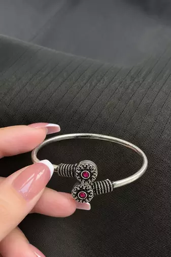 German silver oxidized floral motif red ruby kada bracelet