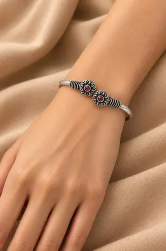 German silver oxidized floral motif red ruby kada bracelet