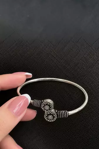 German silver oxidized floral motif pink kada bracelet