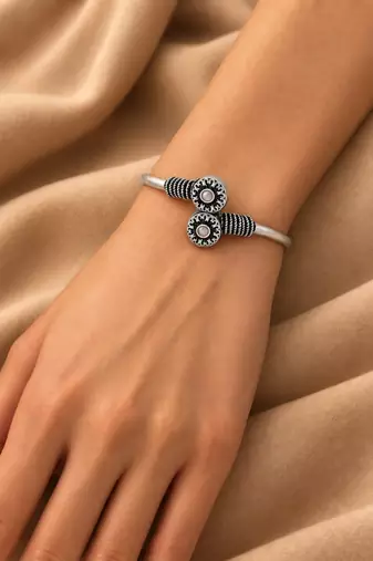 German silver oxidized floral motif pink kada bracelet