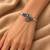 German silver oxidized floral motif pink kada bracelet